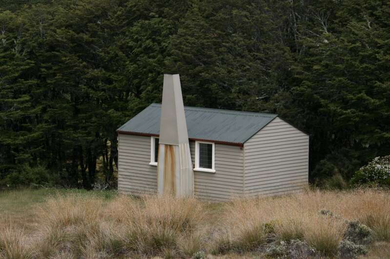 The hut sitting in dry tussock